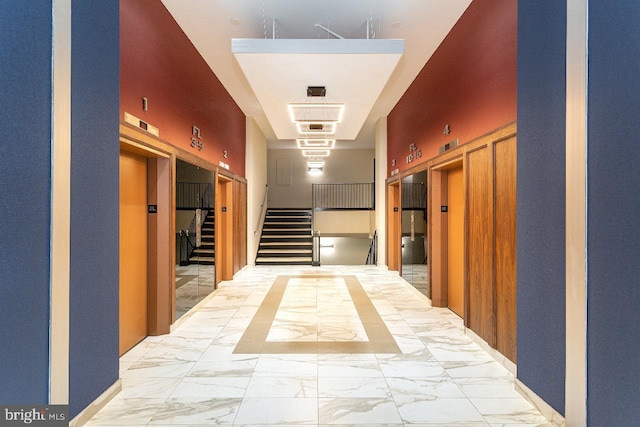 4600 Duke St Unit 1018, Alexandria, VA 22304 - hall with marble finish floor, stairs, and elevator