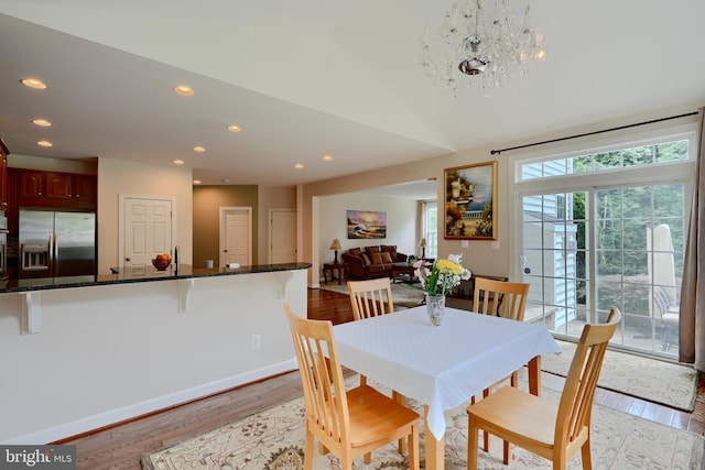 dining area featuring recessed lighting, light wood finished floors, and baseboards