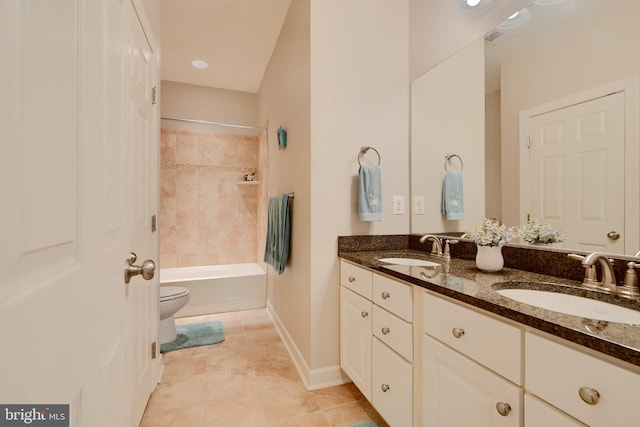 bathroom with double vanity, toilet, shower / tub combination, and tile patterned flooring