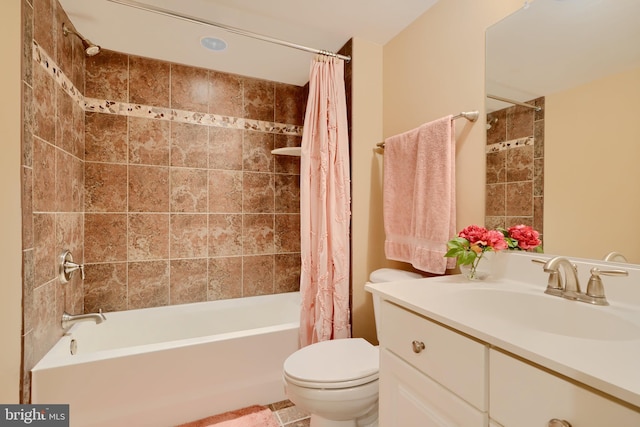 bathroom with shower / tub combo, toilet, and vanity