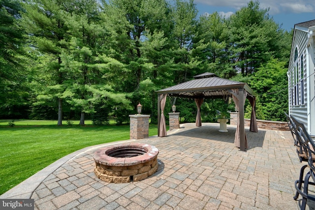 view of patio with a gazebo and a fire pit
