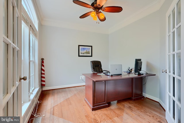home office featuring ornamental molding, light wood finished floors, ceiling fan, baseboards, and french doors