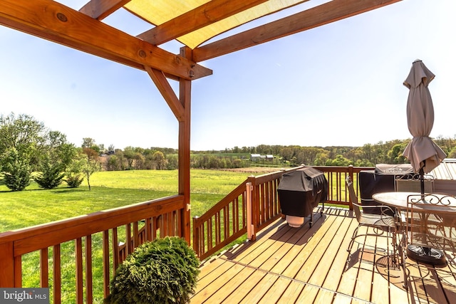 deck featuring area for grilling, a yard, and a pergola