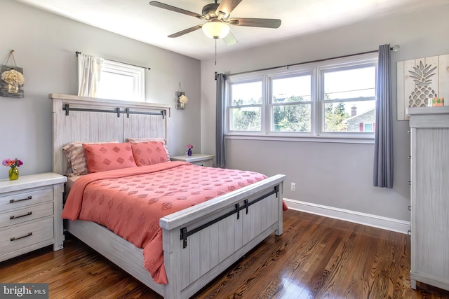 bedroom with dark wood-style floors, ceiling fan, and baseboards