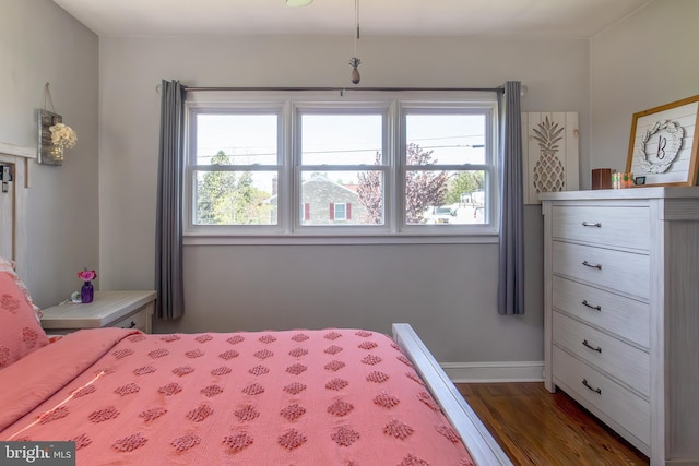 bedroom with wood finished floors