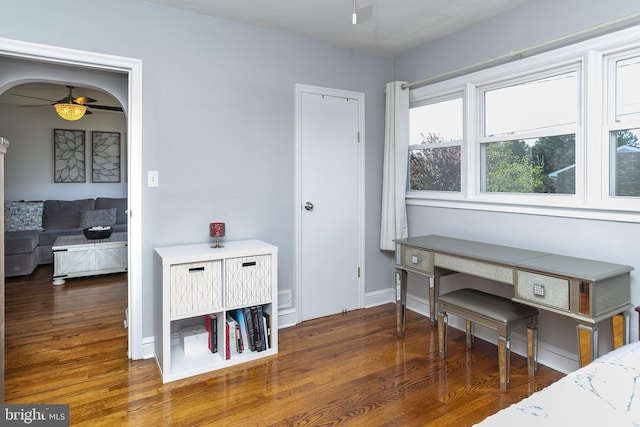 interior space featuring wood finished floors and baseboards