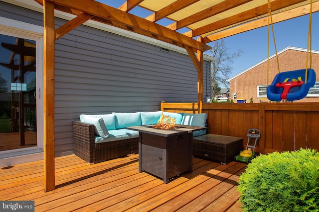deck with an outdoor living space with a fire pit and a pergola