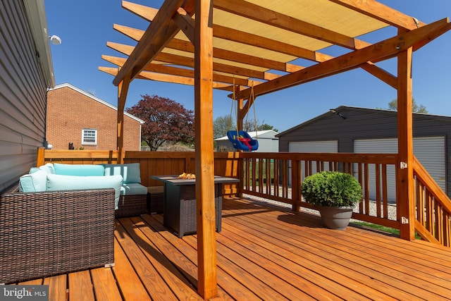 wooden terrace featuring a pergola and an outdoor hangout area