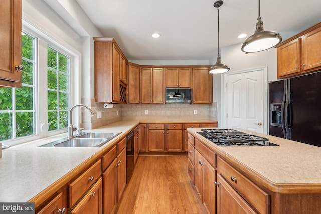6 Crawford Ln, Stafford, VA 22556 - kitchen featuring light wood-style floors, a sink, black appliances, and light countertops