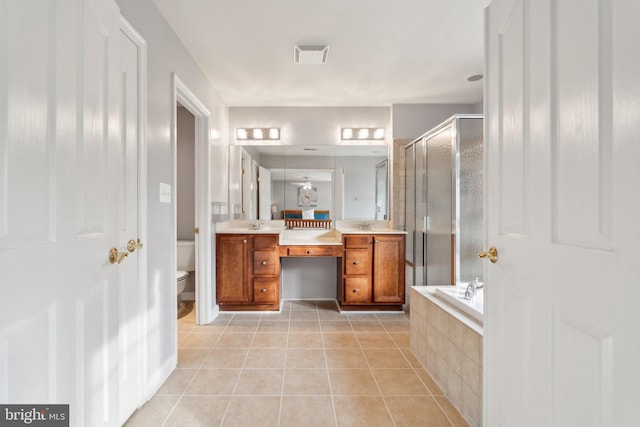 6 Crawford Ln, Stafford, VA 22556 - full bathroom featuring visible vents, tile patterned flooring, a shower with shower door, a relaxing tiled tub, and toilet