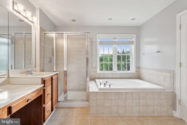 6 Crawford Ln, Stafford, VA 22556 - bathroom featuring tile patterned flooring, a garden tub, a shower stall, and vanity