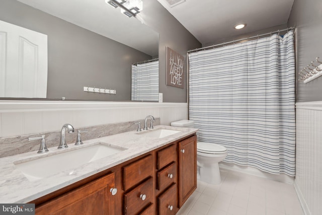 6 Crawford Ln, Stafford, VA 22556 - full bathroom with a sink, wainscoting, and double vanity