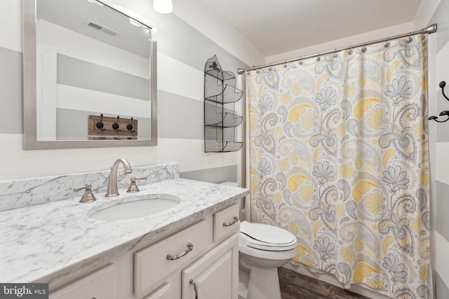 6 Crawford Ln, Stafford, VA 22556 - full bathroom featuring visible vents, vanity, wood finished floors, toilet, and a shower with curtain