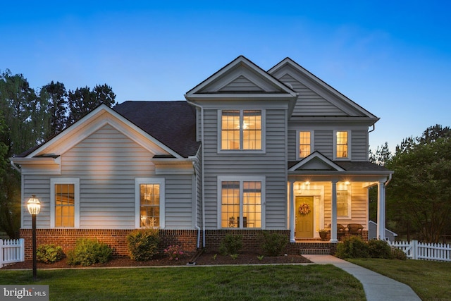 6 Crawford Ln, Stafford, VA 22556 - craftsman-style home with a porch, brick siding, fence, and a front yard