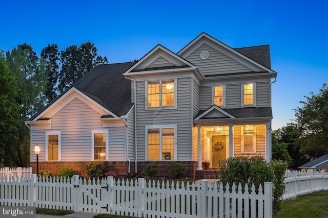 6 Crawford Ln, Stafford, VA 22556 - view of front of house featuring brick siding and a fenced front yard