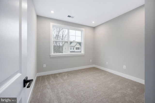 empty room featuring baseboards, carpet flooring, recessed lighting, and visible vents