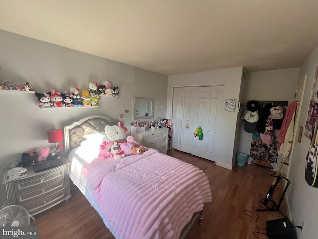 bedroom with a closet and wood finished floors