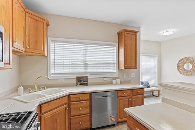 10232 Rutland Round Rd Unit 24, Columbia, MD 21044 - kitchen with appliances with stainless steel finishes, brown cabinets, light countertops, and a sink