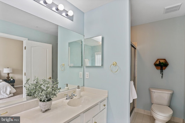 10232 Rutland Round Rd Unit 24, Columbia, MD 21044 - full bathroom featuring tile patterned floors, a shower with door, toilet, vanity, and visible vents