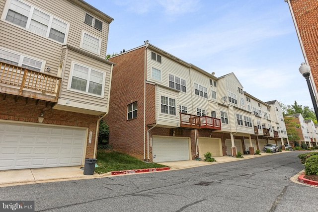10232 Rutland Round Rd Unit 24, Columbia, MD 21044 - view of building exterior with an attached garage and a residential view
