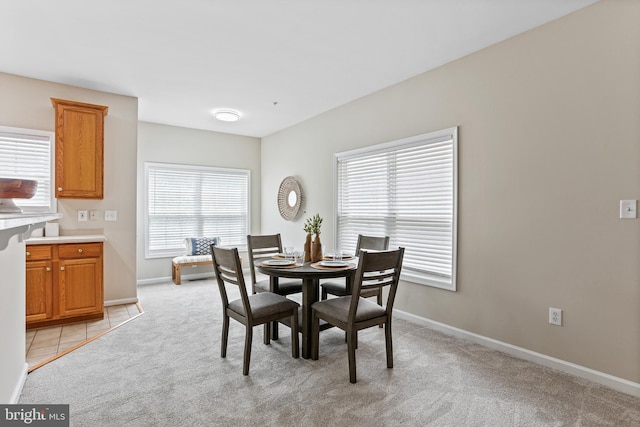 10232 Rutland Round Rd Unit 24, Columbia, MD 21044 - dining room featuring baseboards and light carpet