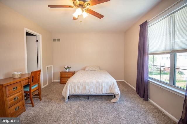 bedroom with visible vents, ceiling fan, baseboards, and carpet floors