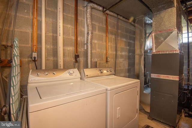 washroom with washer and clothes dryer and laundry area