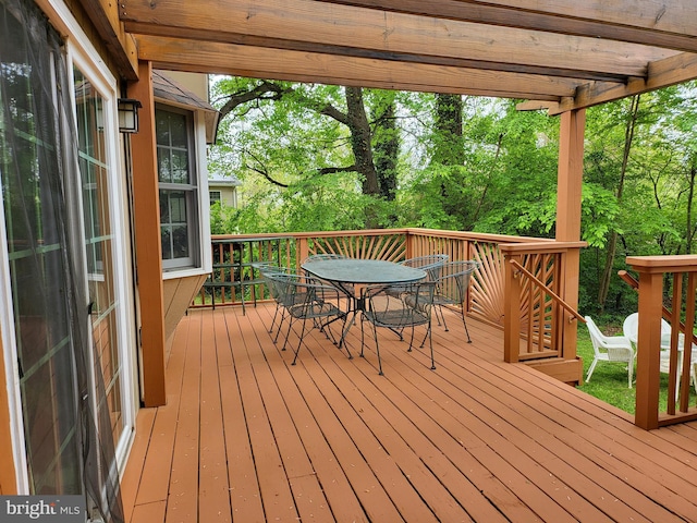 wooden deck with outdoor dining space