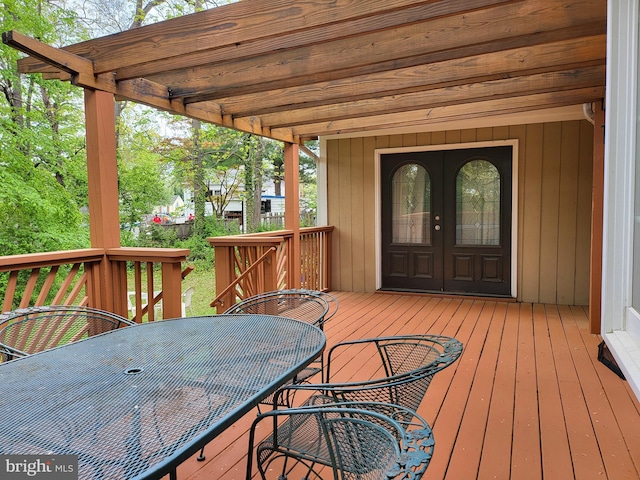 wooden terrace featuring outdoor dining space