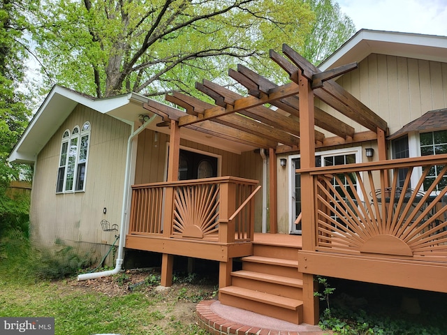 back of property with a pergola and a deck