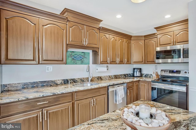 611 Cypress Rd, Severna Park, MD 21146 - kitchen with light stone counters, stainless steel appliances, recessed lighting, and a sink
