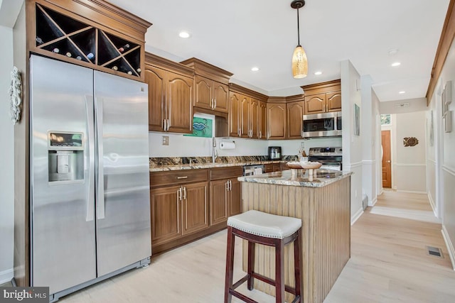 611 Cypress Rd, Severna Park, MD 21146 - kitchen featuring light stone countertops, light wood-type flooring, visible vents, and appliances with stainless steel finishes