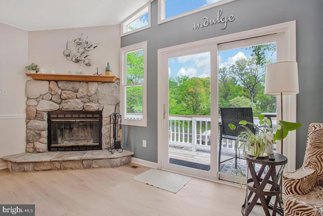 611 Cypress Rd, Severna Park, MD 21146 - doorway to outside featuring a fireplace, baseboards, visible vents, and wood finished floors