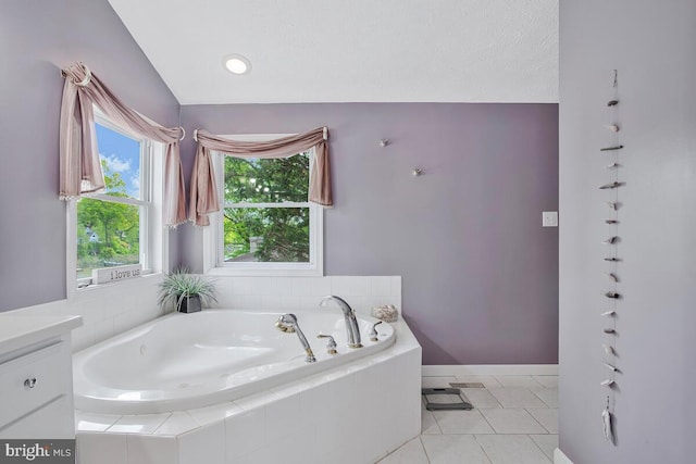 611 Cypress Rd, Severna Park, MD 21146 - full bathroom featuring vanity, baseboards, tile patterned floors, vaulted ceiling, and a garden tub