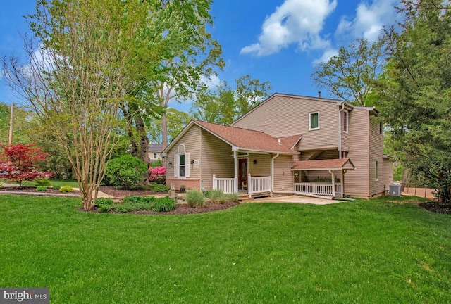 611 Cypress Rd, Severna Park, MD 21146 - rear view of property with central AC unit and a yard