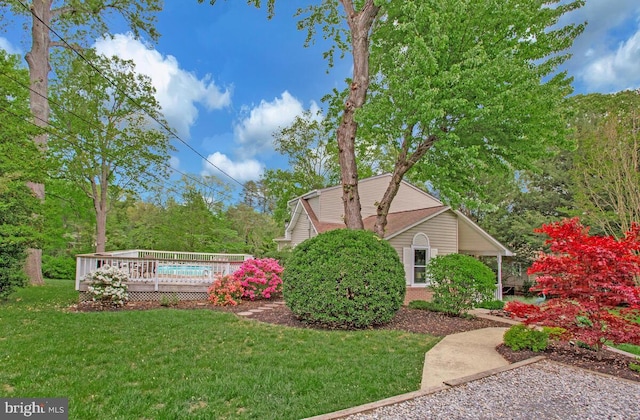 611 Cypress Rd, Severna Park, MD 21146 - view of home's exterior featuring a deck, brick siding, and a lawn