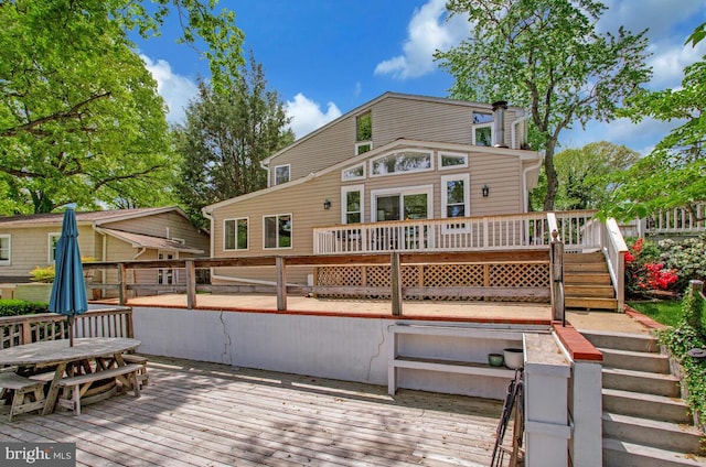 611 Cypress Rd, Severna Park, MD 21146 - back of property featuring outdoor dining area, stairway, and a deck