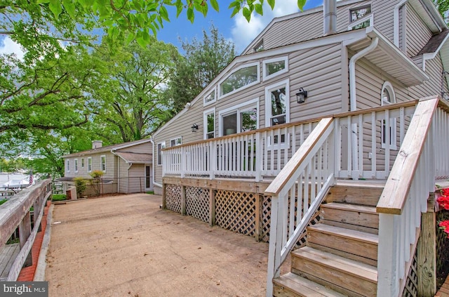 611 Cypress Rd, Severna Park, MD 21146 - rear view of house featuring stairway and a wooden deck