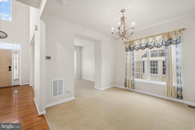 1201 Preserve Ln, Fredericksburg, VA 22401 - unfurnished dining area with an inviting chandelier, visible vents, a healthy amount of sunlight, and baseboards