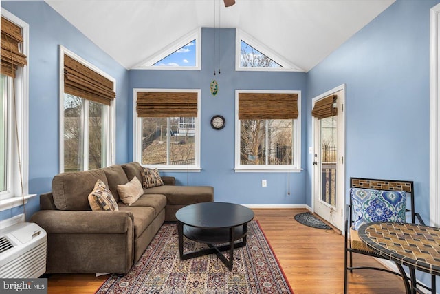 1201 Preserve Ln, Fredericksburg, VA 22401 - living area featuring a wall mounted AC, ceiling fan, vaulted ceiling, baseboards, and wood finished floors