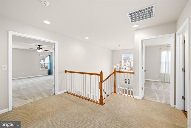 1201 Preserve Ln, Fredericksburg, VA 22401 - hallway featuring an upstairs landing, visible vents, an inviting chandelier, and carpet