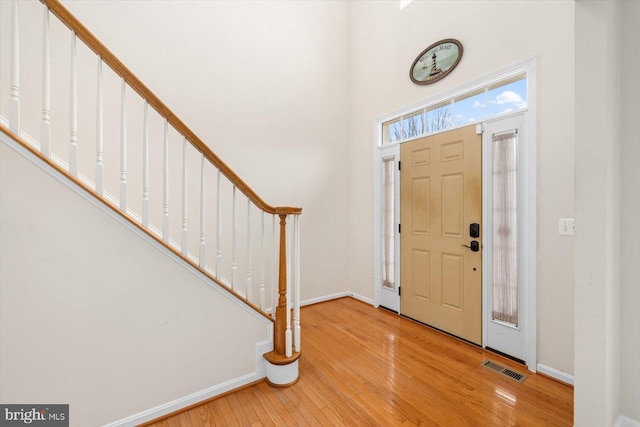 1201 Preserve Ln, Fredericksburg, VA 22401 - foyer entrance featuring baseboards, visible vents, wood finished floors, and stairs