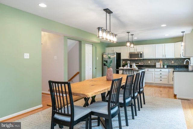 4600 Forge Acre Dr, Perry Hall, MD 21128 - dining area with recessed lighting, light wood-style flooring, and baseboards