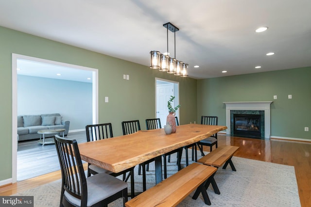 4600 Forge Acre Dr, Perry Hall, MD 21128 - dining space featuring light wood-style floors, recessed lighting, baseboards, and a premium fireplace