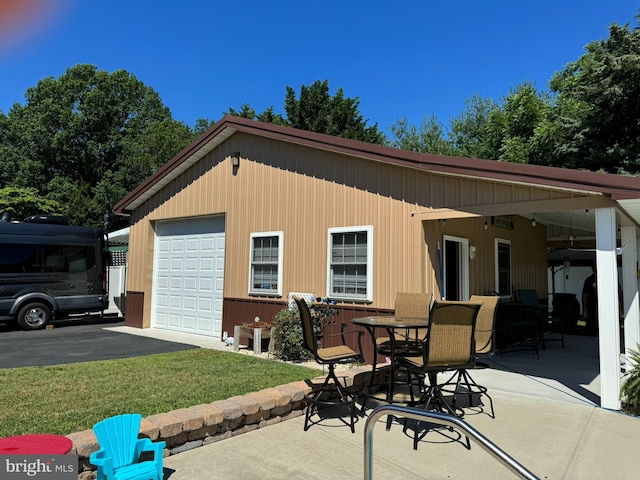 exterior space with a lawn and driveway