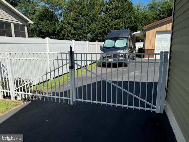 view of gate with fence