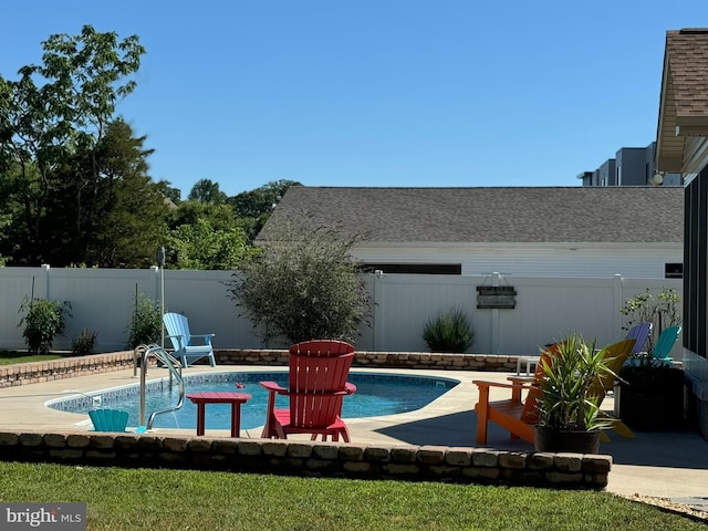 view of swimming pool with a fenced backyard, a fenced in pool, and a patio area