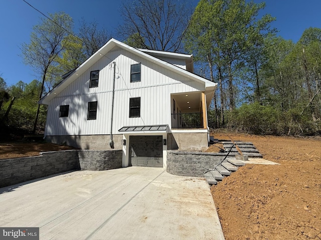 159 Rudloff Ln, Mohnton, PA 19540 - view of side of property featuring driveway, a garage, a standing seam roof, and metal roof
