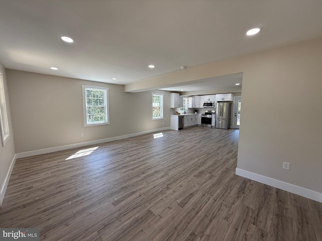 159 Rudloff Ln, Mohnton, PA 19540 - unfurnished living room featuring baseboards, recessed lighting, and dark wood finished floors