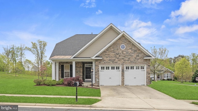 craftsman-style home featuring concrete driveway, stone siding, a front yard, and an attached garage